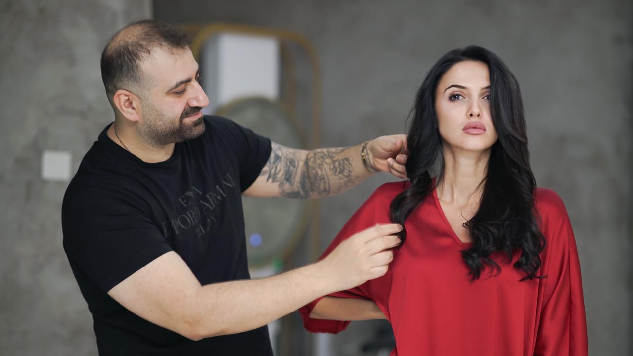 Hadi Salon with a client